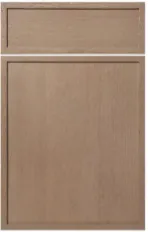 Wood cabinet door with raised rectangular panel and separate horizontal drawer front piece above.