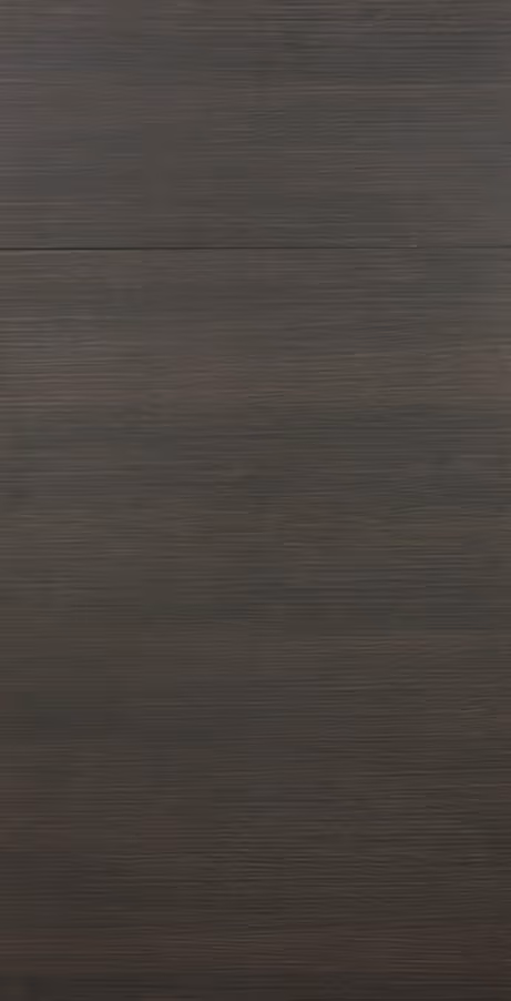 Dark brown wood texture with subtle grain and a horizontal seam in the center.