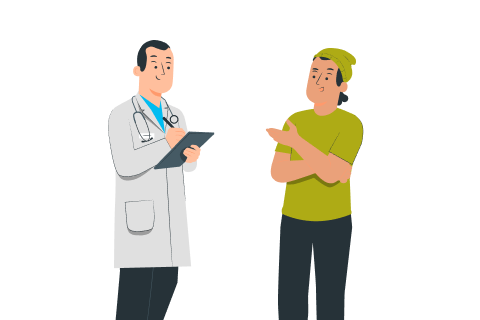 Doctor in white coat holding clipboard talks to a young man in a green shirt and hat.