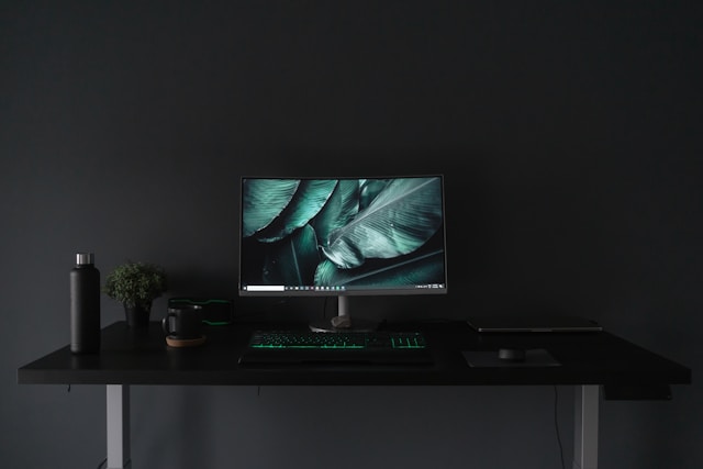 Dark moody minimal work space