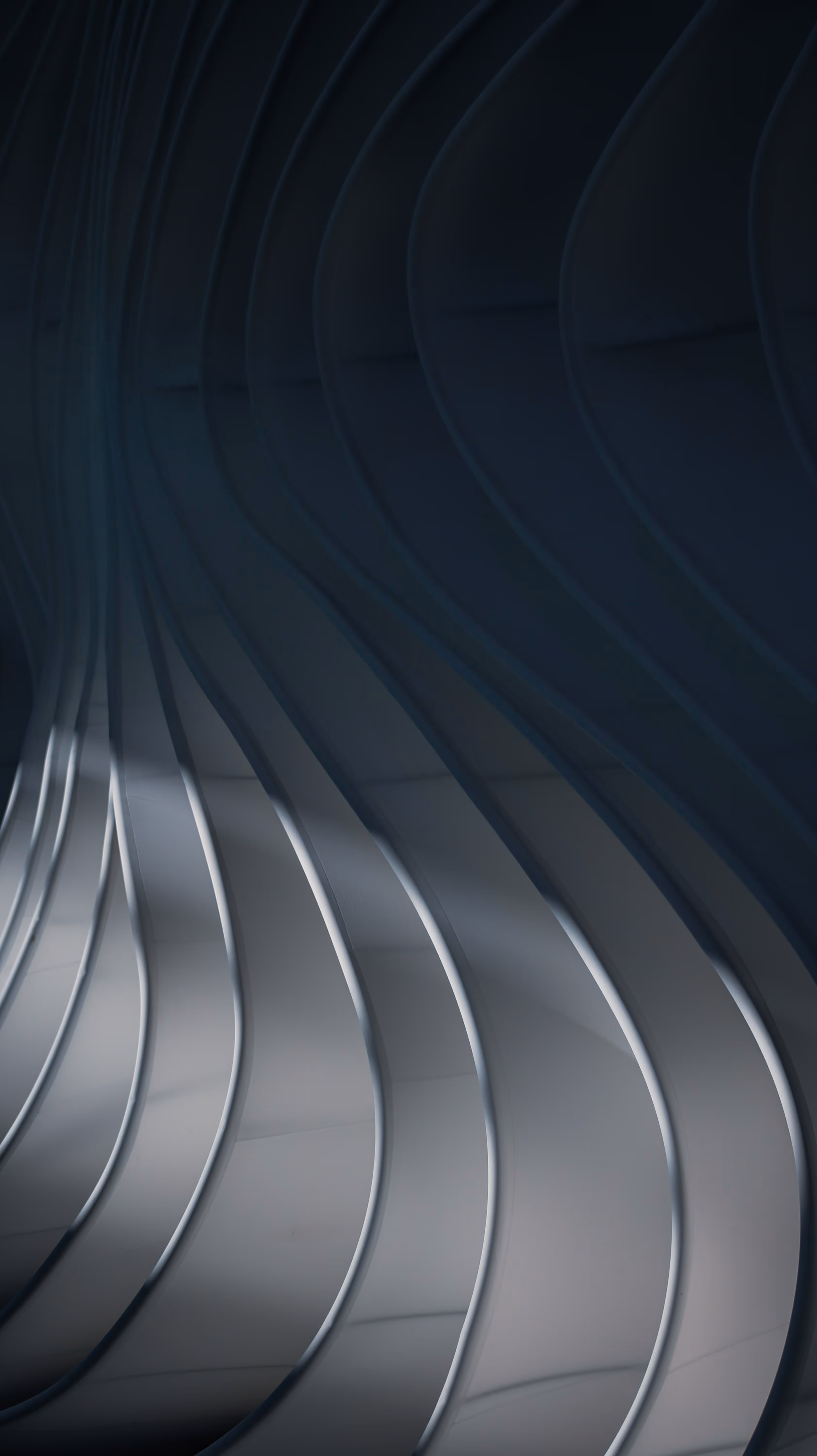 Abstract 3D cluster of curved shapes in white and blue floating against gradient background.