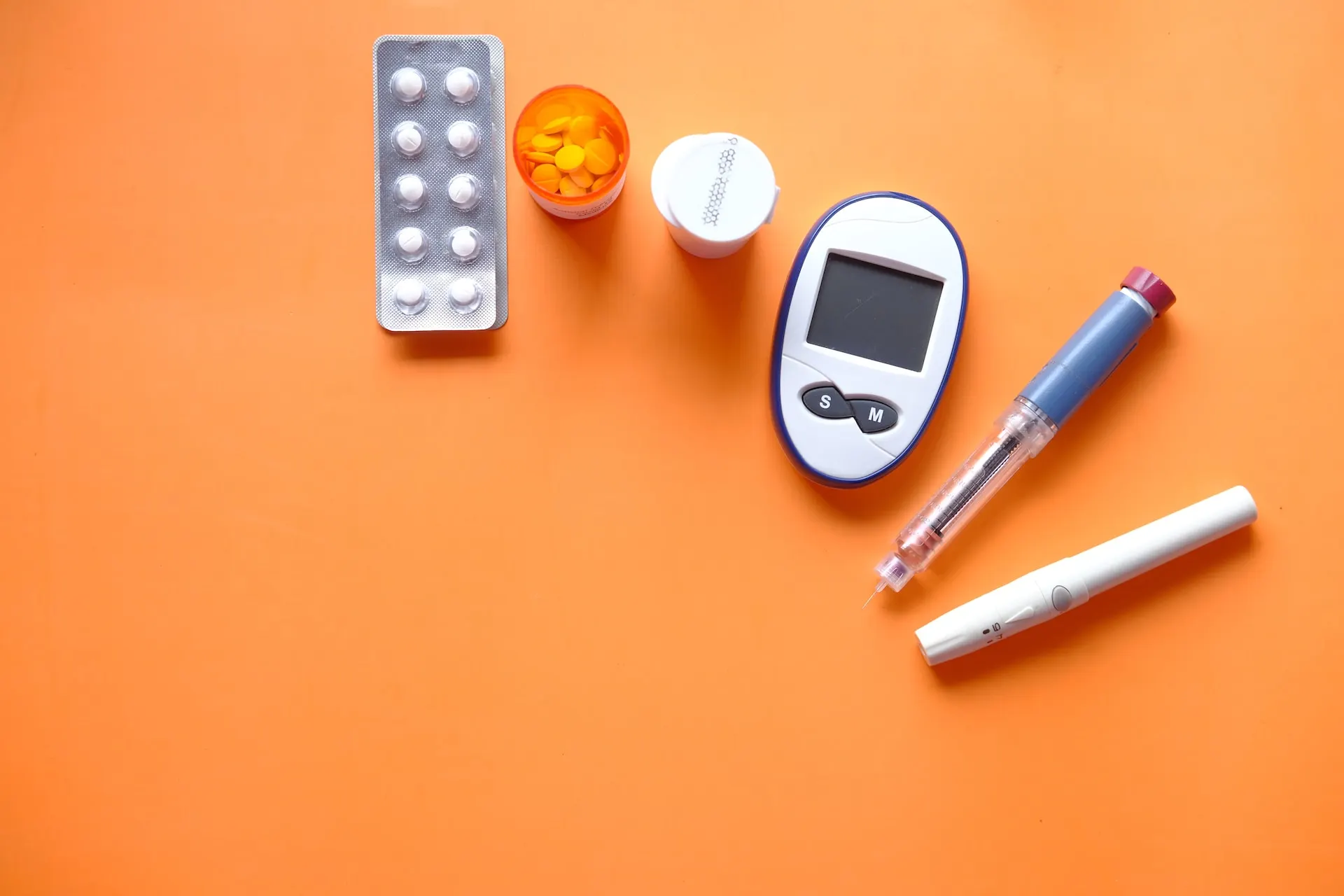 different-diabetes-elements-in-an-orange-background
