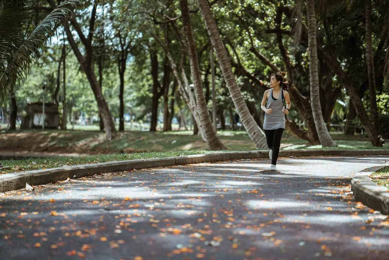 asian-woman-jogging-in-park-in-sunny-day