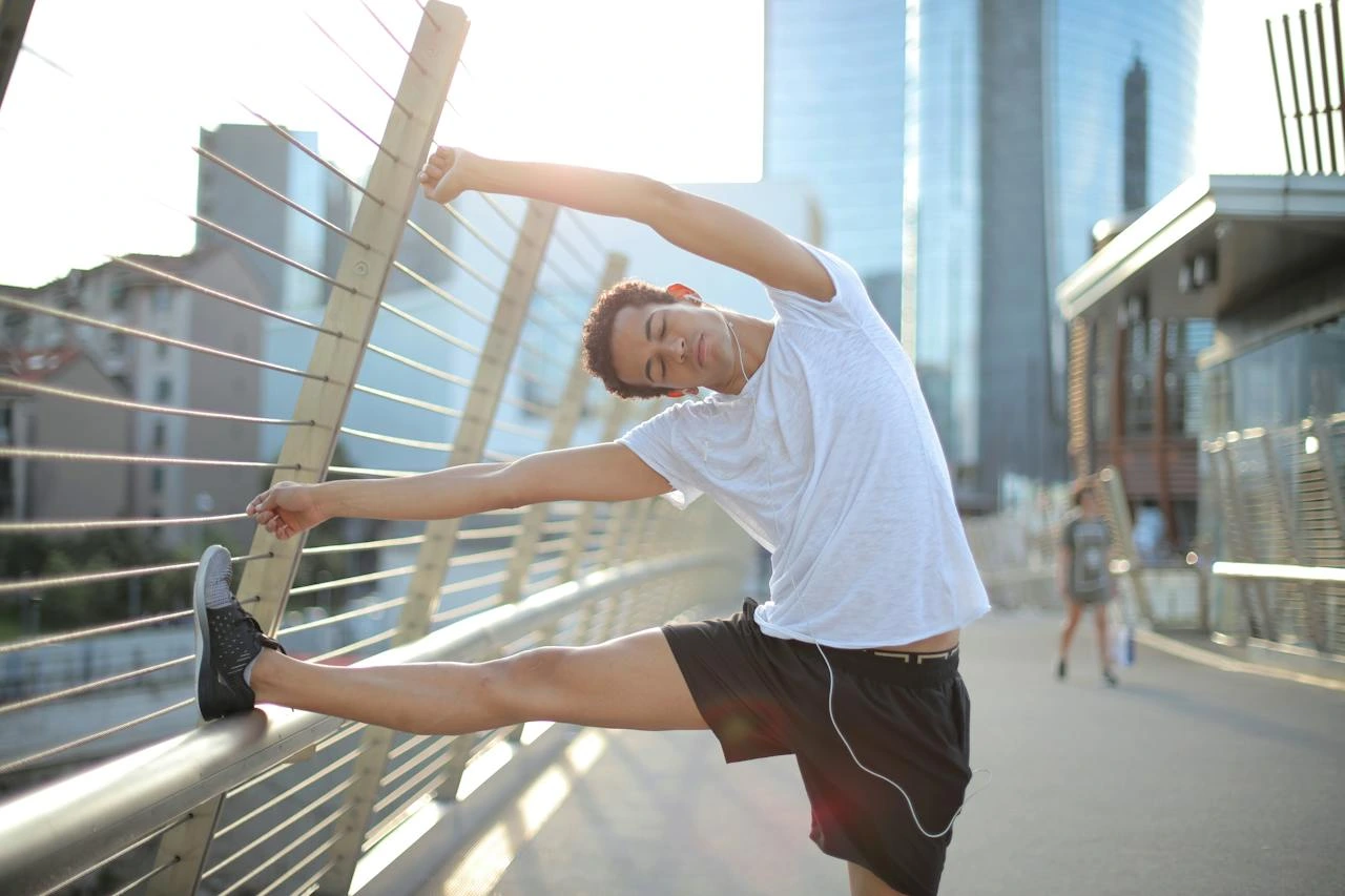 man stretching pre run
