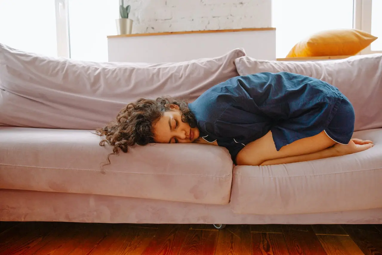 woman shruken on the couch