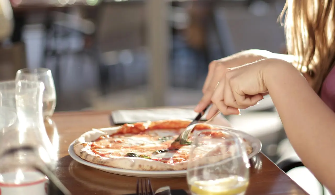 Woman eating pizza