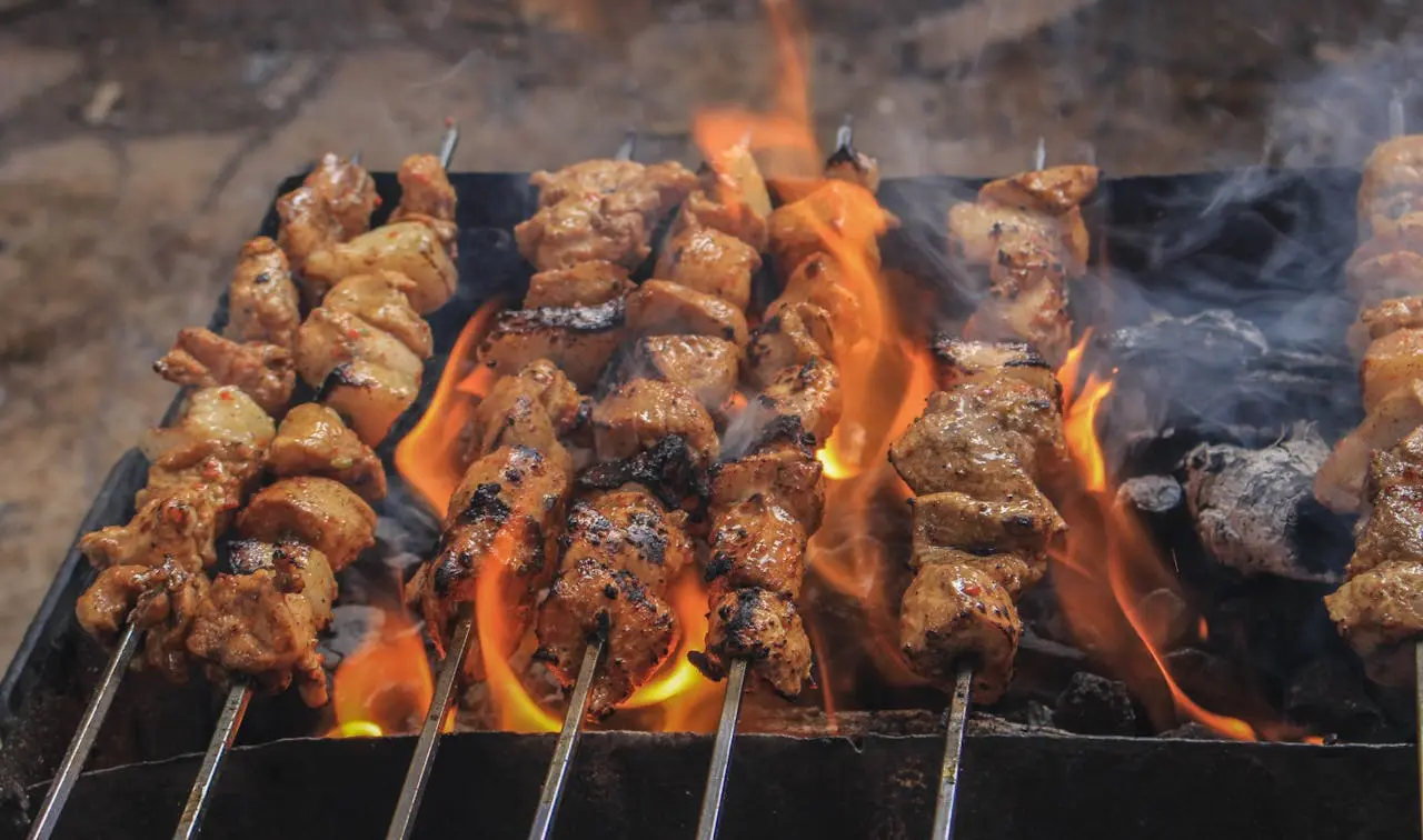 Meat brochettes on a grill