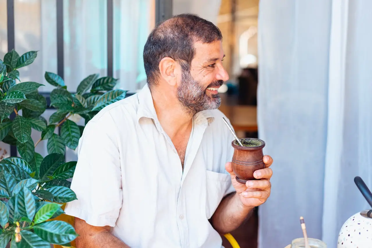 Man enjoying yerba mate drink.