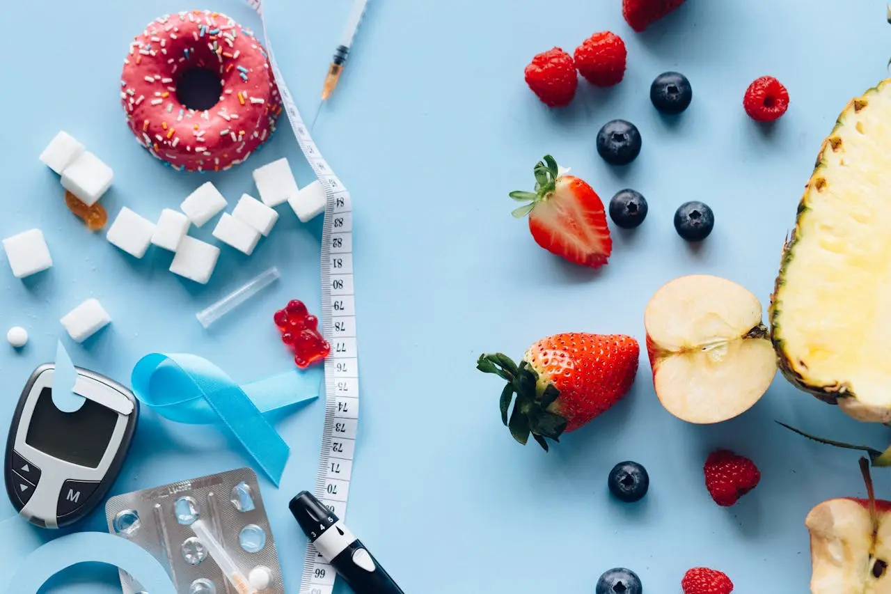 Fruits, donuts, sugar cubes, and elements to track blood sugar levels