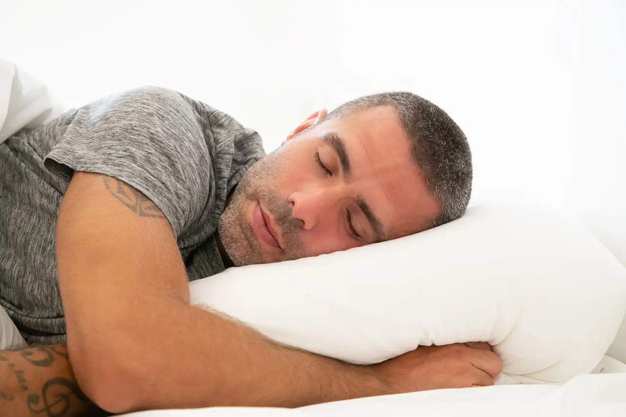 Man in gray tshirt sleeping