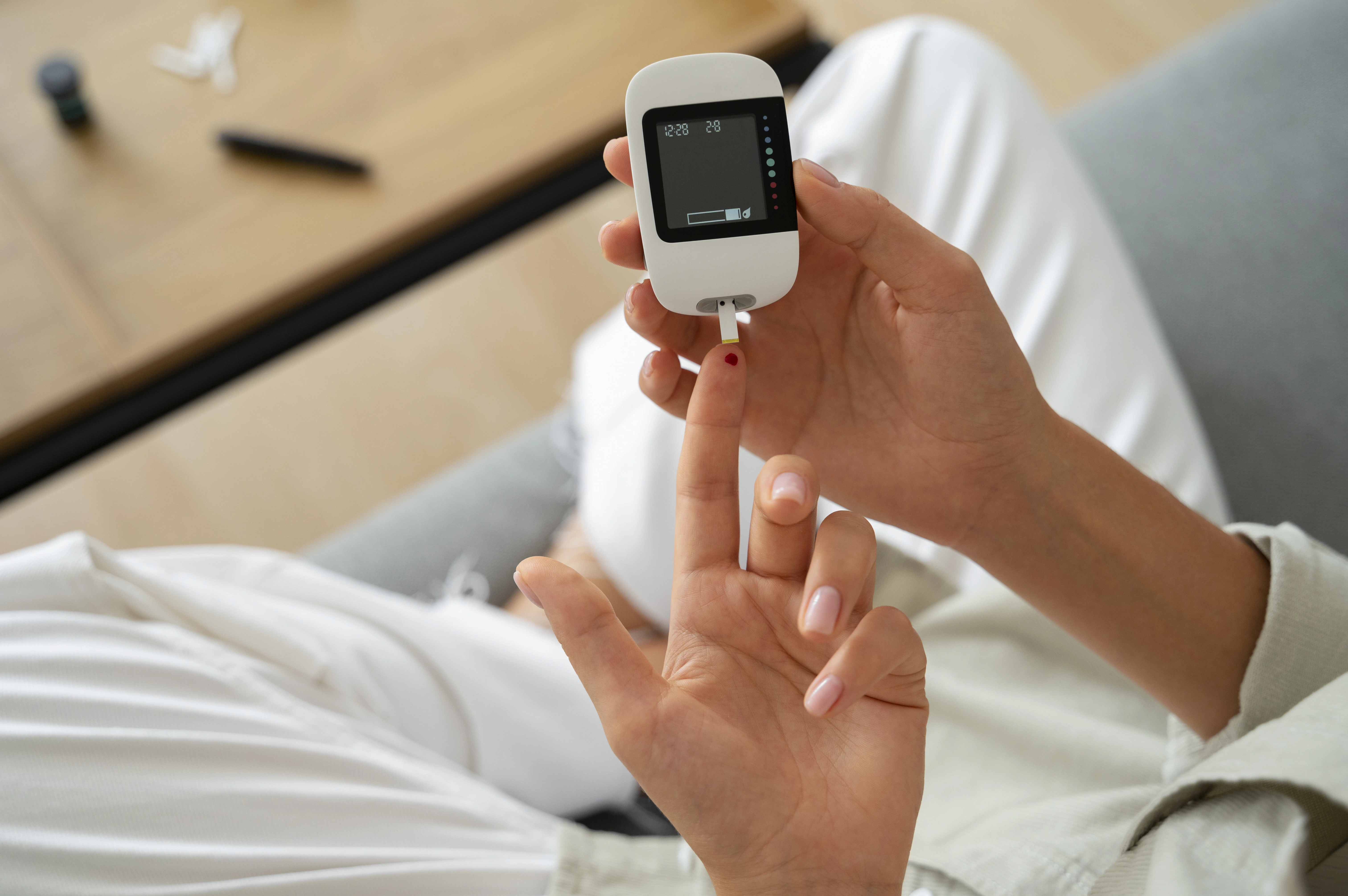 Woman measuring her blood sugar levels