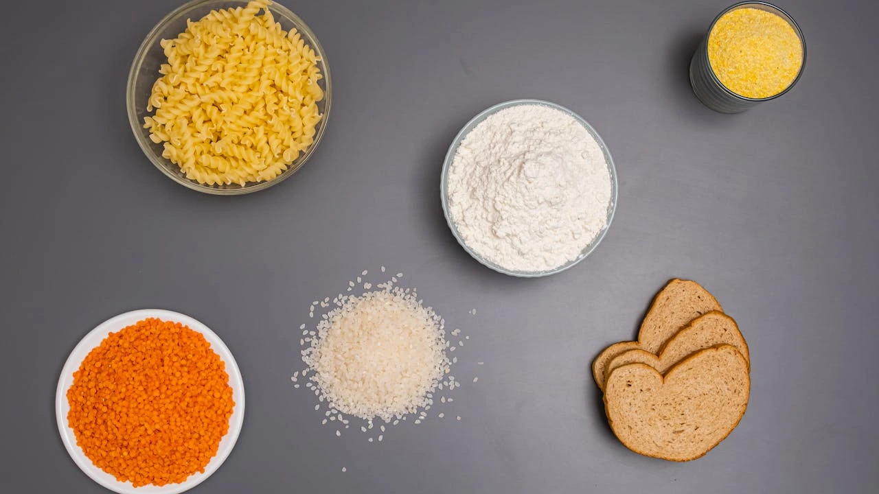 Table with different types of carbs in bowls