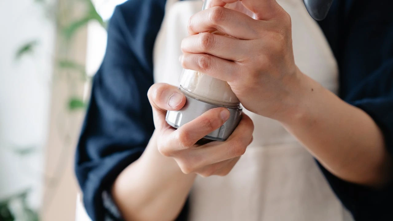Person using a protein shaker
