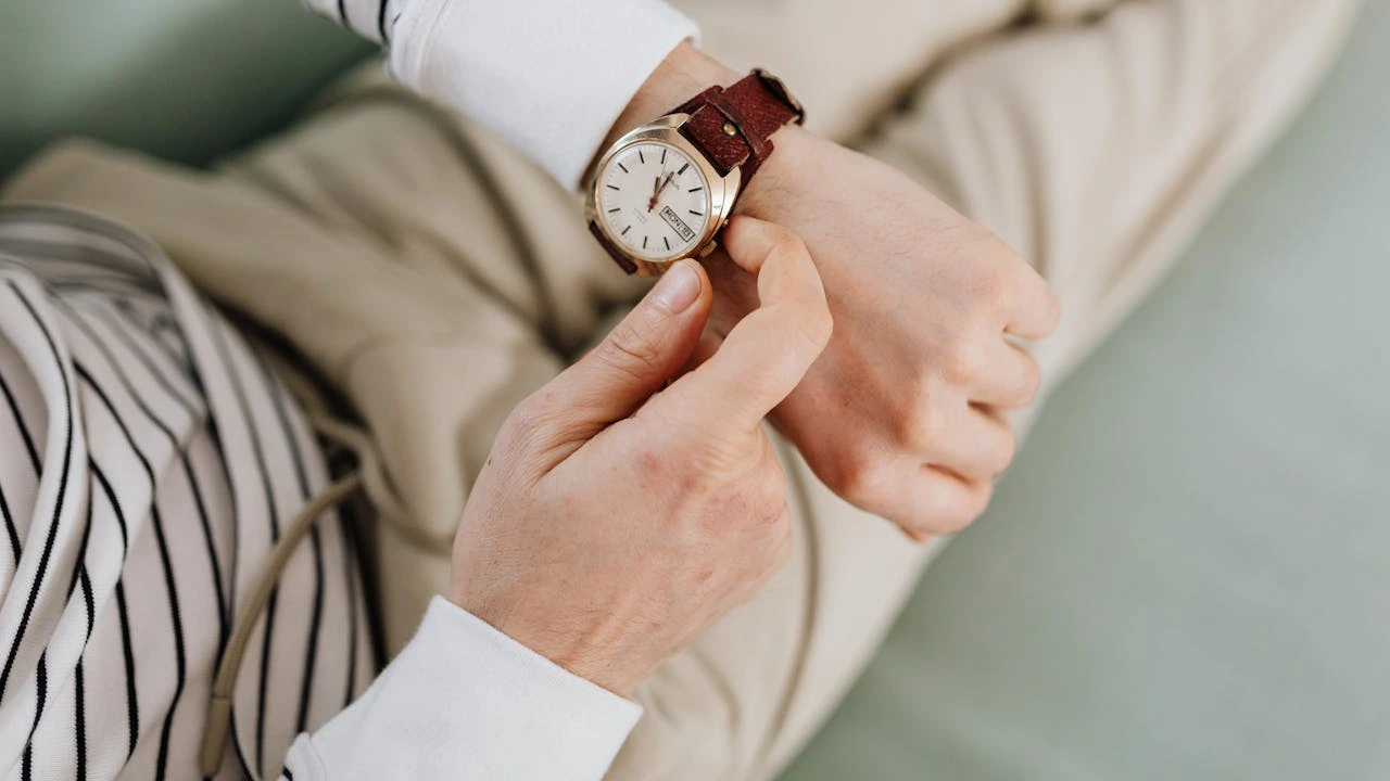 woman adjusting watch