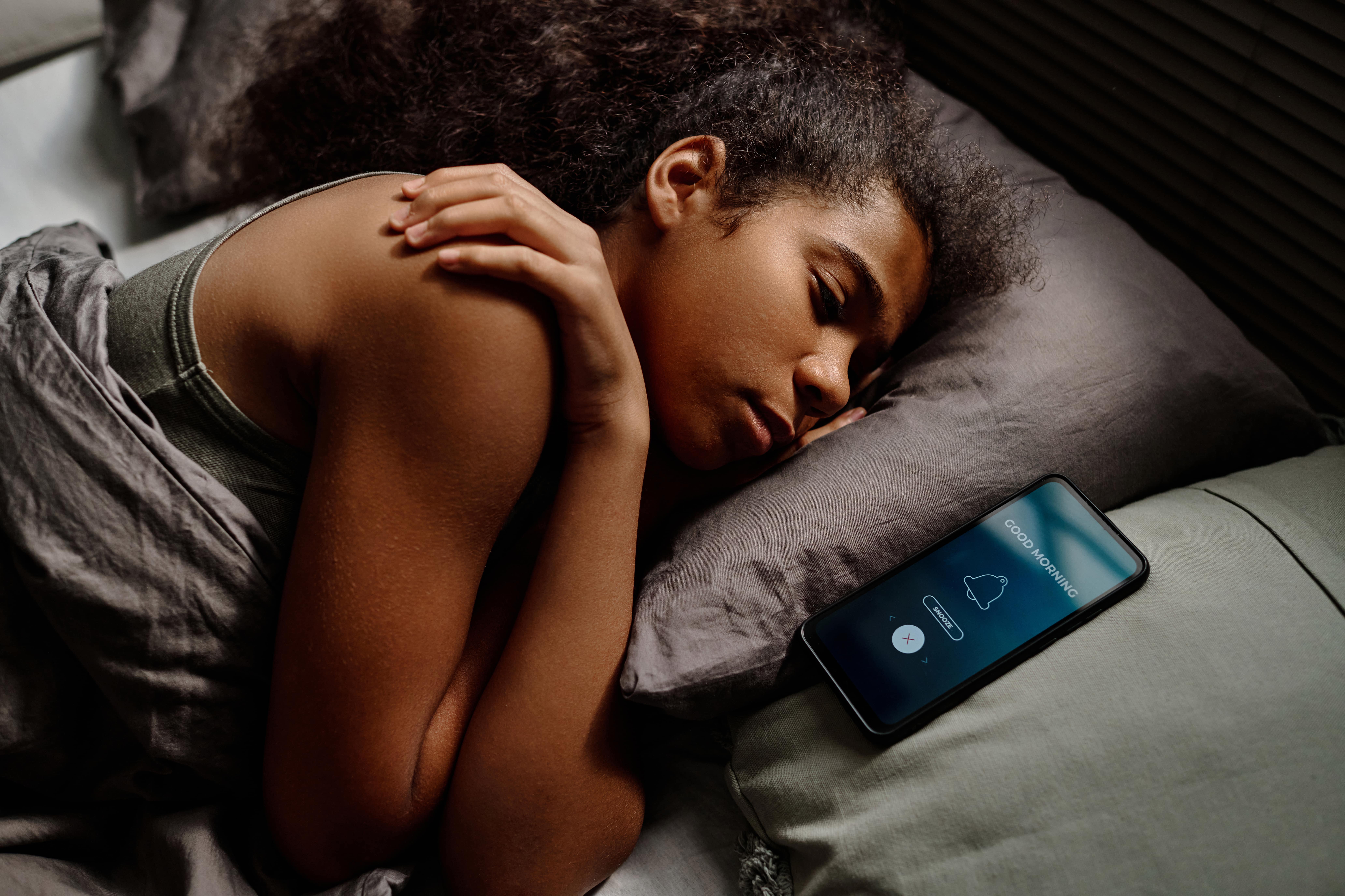 woman sleeping with phone
