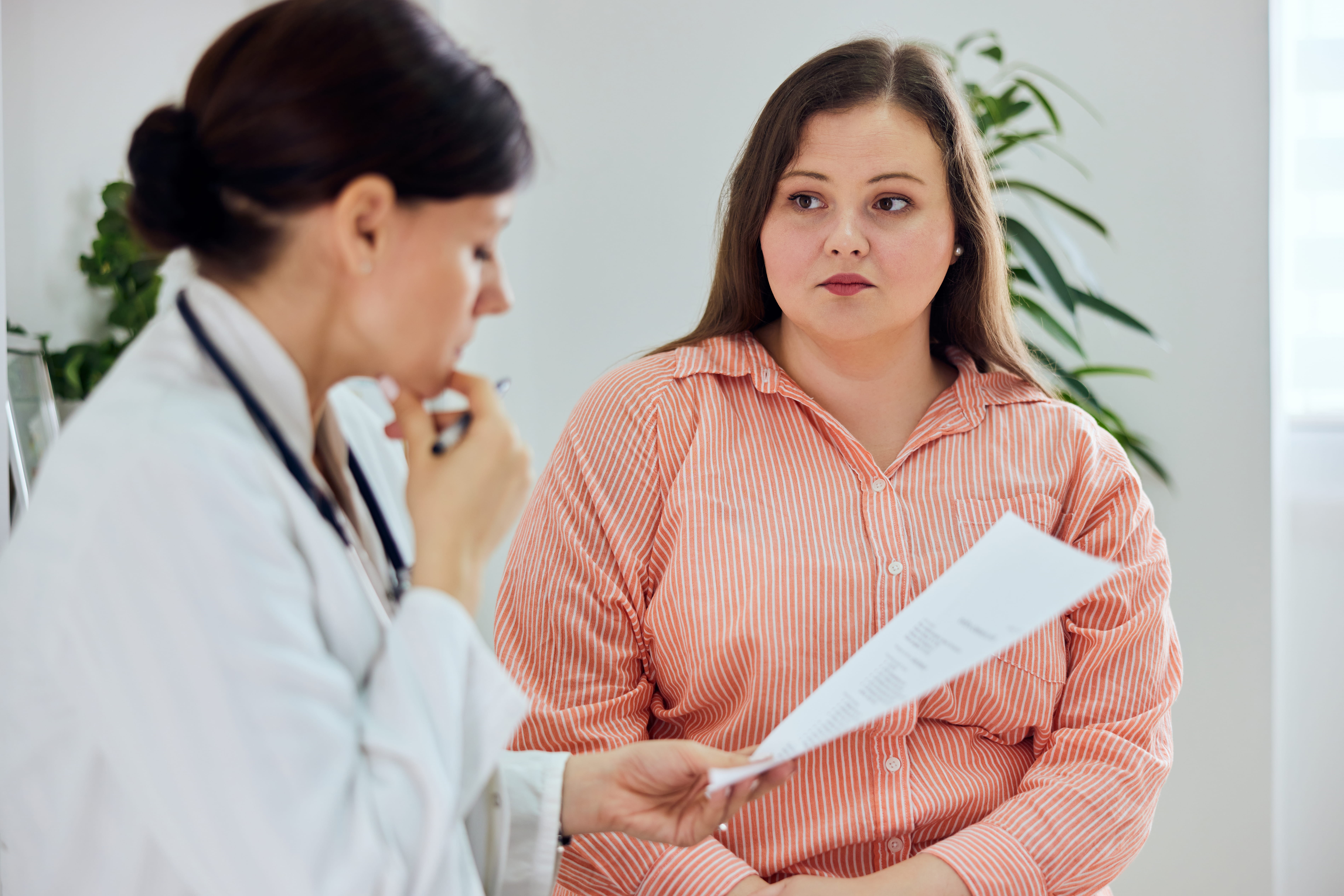 woman talking to doctor