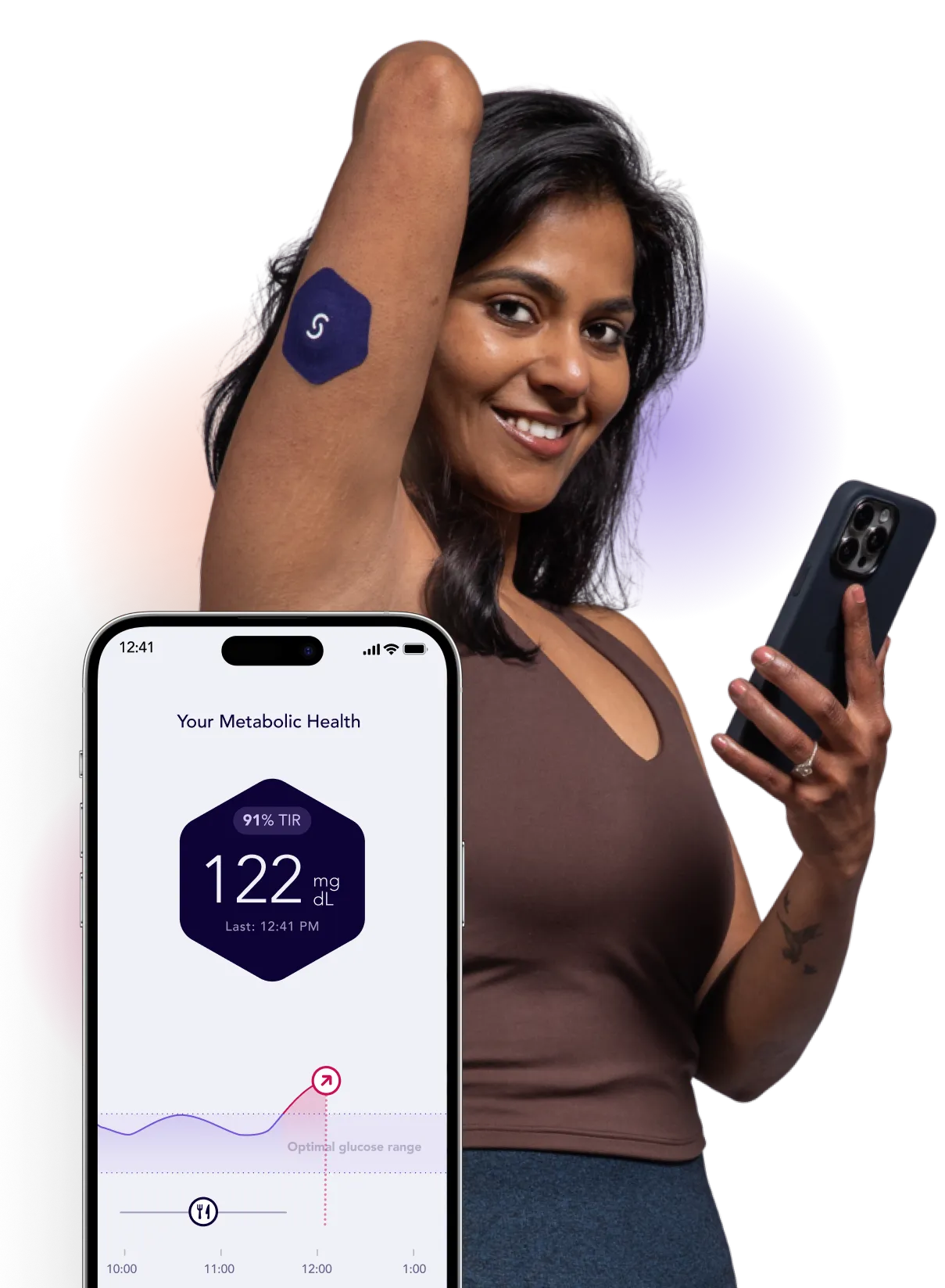 Woman checking metabolic health data on smartphone with glucose monitor
