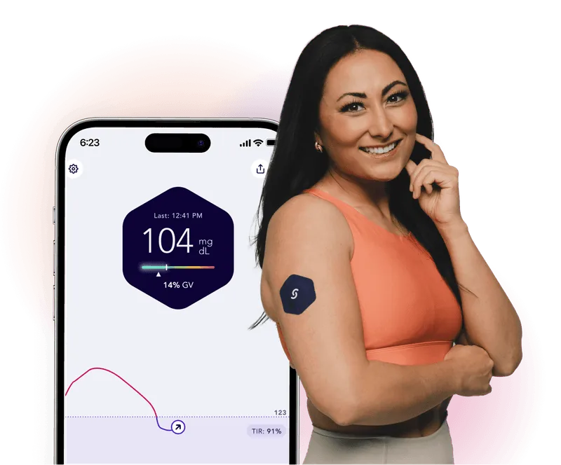 Smiling woman with glucose monitor and smartphone showing diabetes tracking