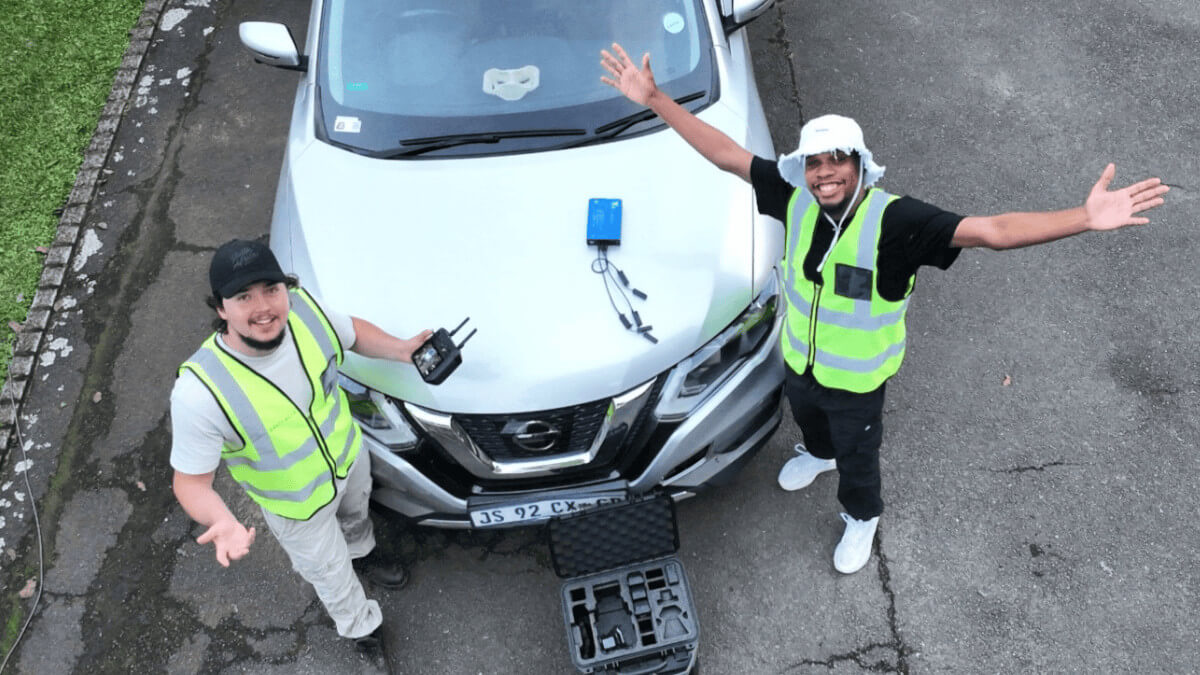Geospatial thumbnail of someone in a hard hat flying a drone