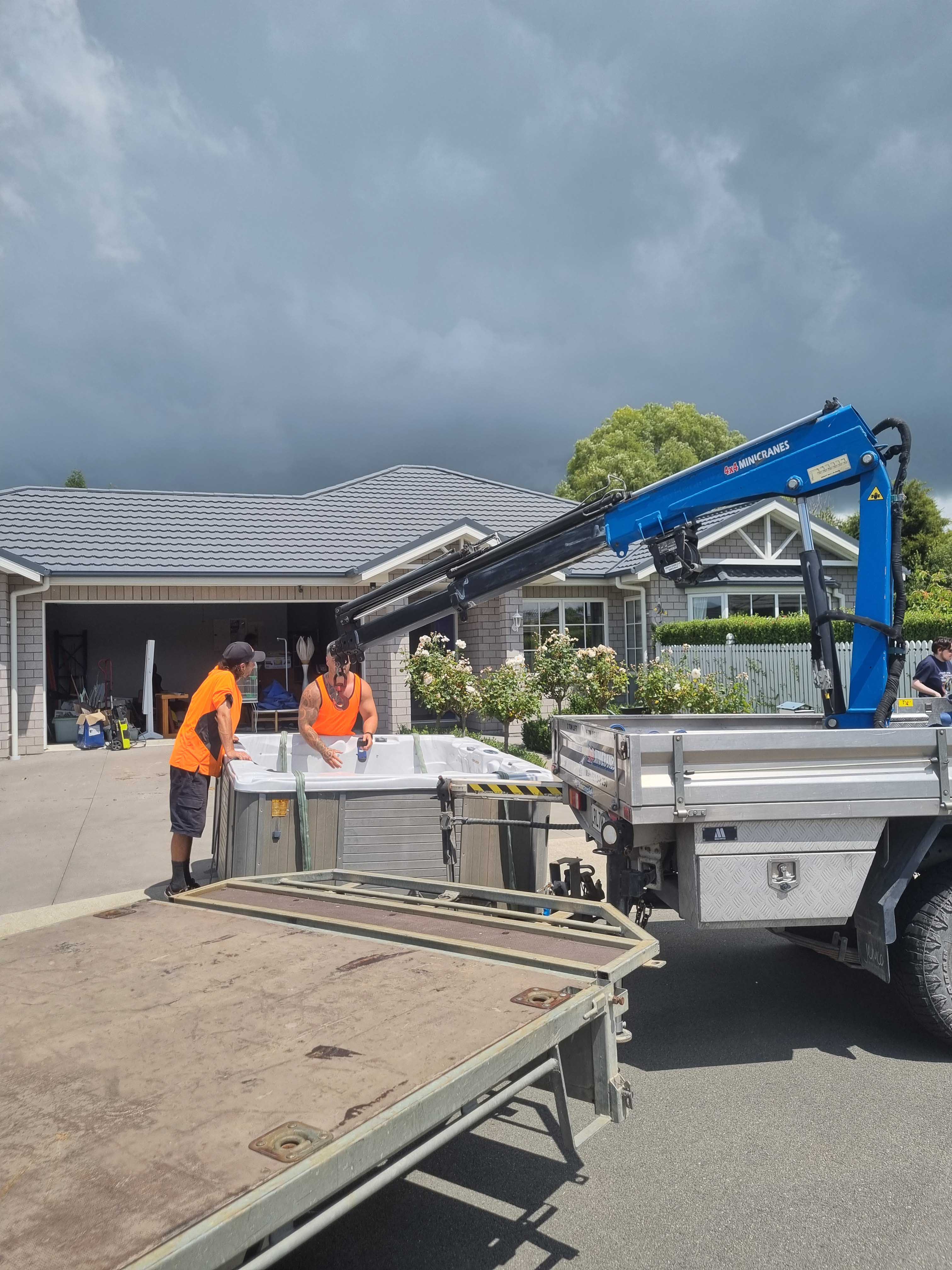 Hiab truck preparing to lift spa
