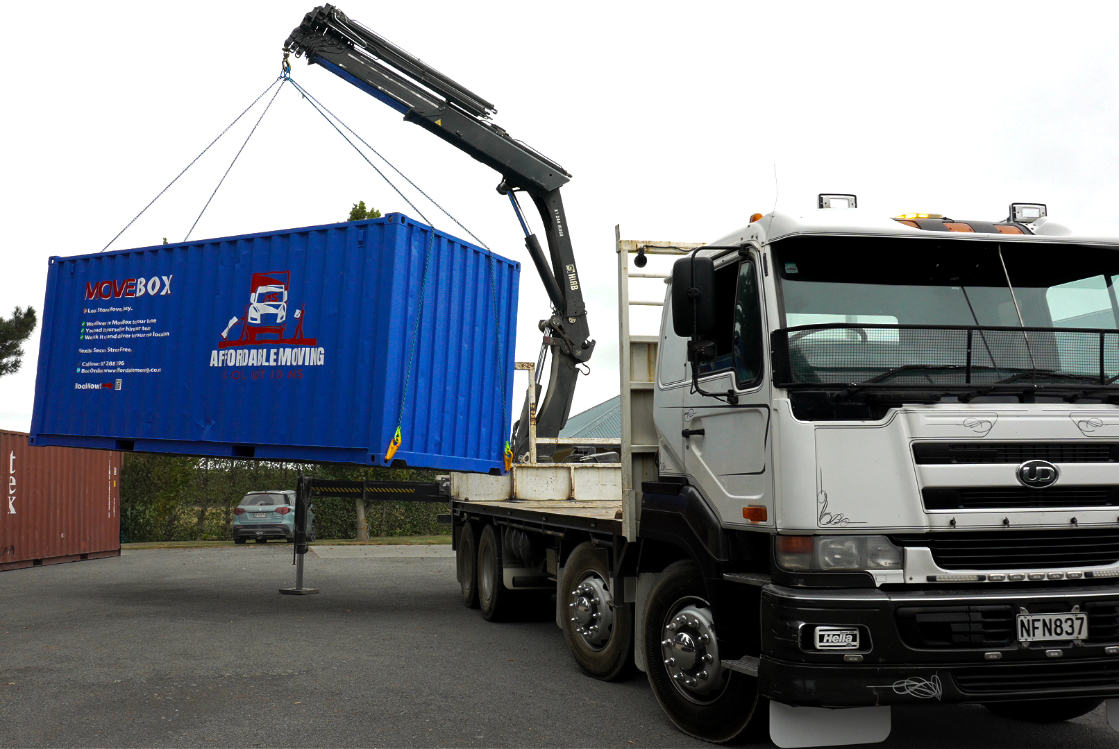 Hiab truck lifting shipping container