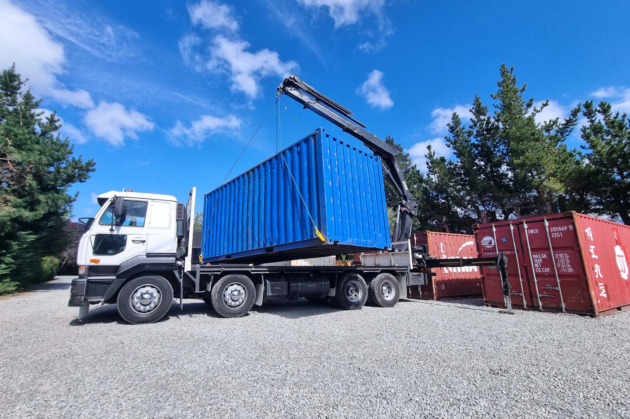 Hiab truck lifting a shipping container
