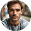 A man with a goatee is looking at the camera.