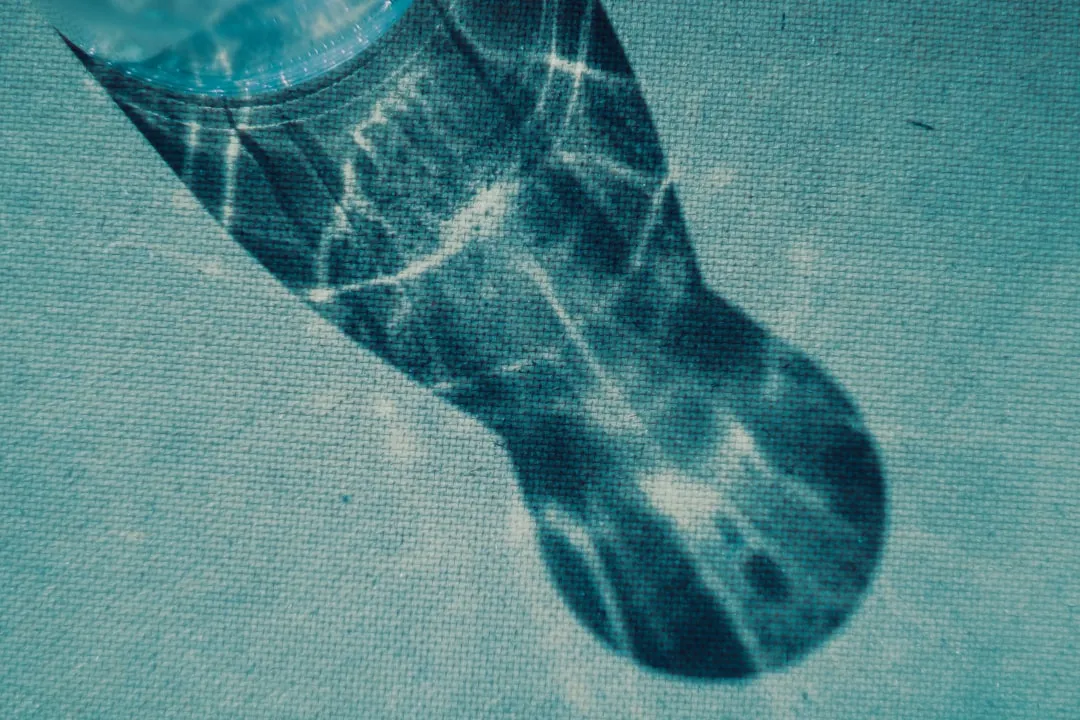 A picture of a person's foot with a watch on it. Photo by Nastia Petruk on Unsplash