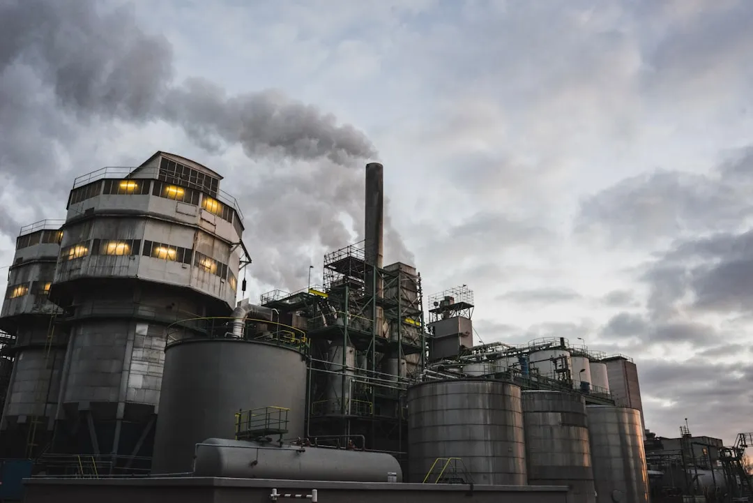white and brown factory during day. Photo by Ehud Neuhaus on Unsplash