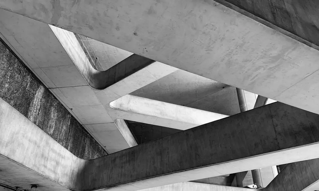 a black and white photo of a concrete structure. Photo by Robert Keane on Unsplash
