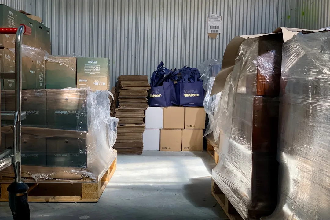 a warehouse filled with lots of boxes and bags. Photo by Manh LE on Unsplash