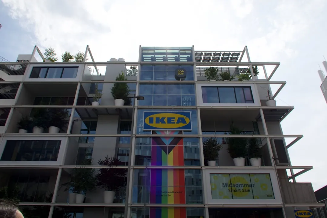 Modern ikea building with a rainbow flag display.. Photo by Aurora Song on Unsplash