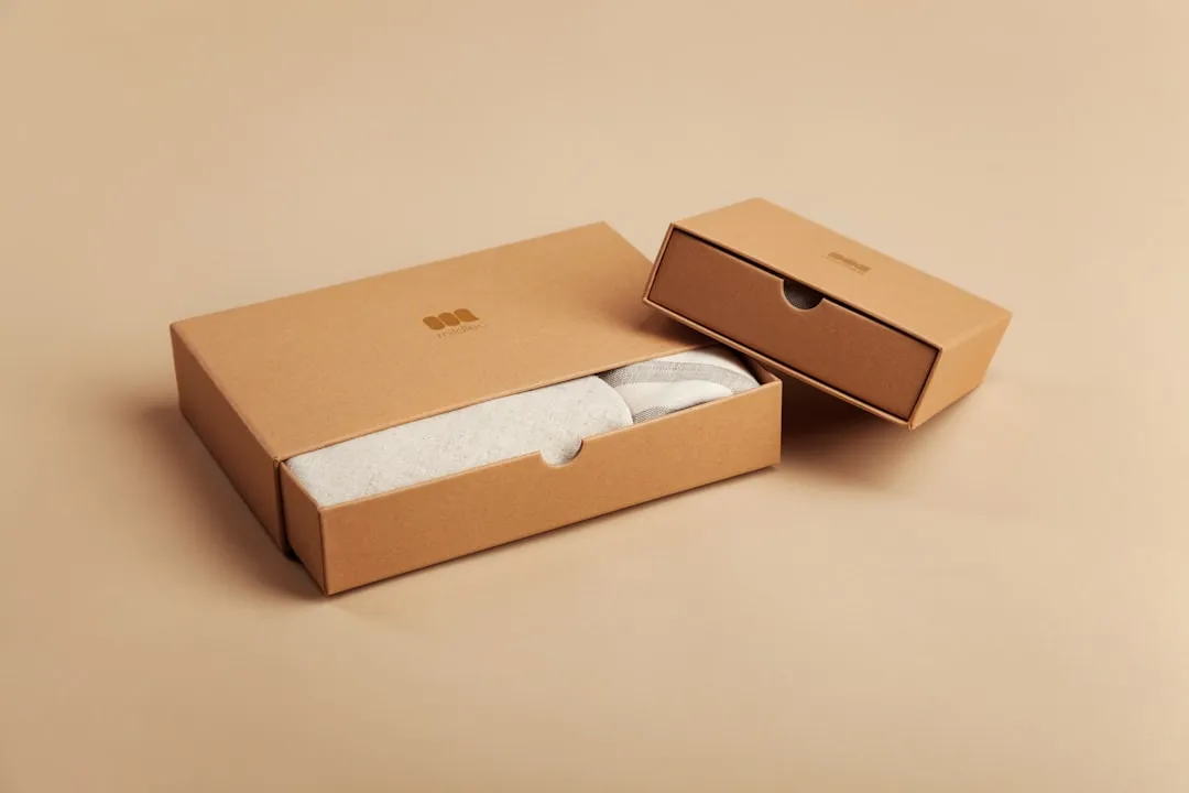 brown cardboard box on white table. Photo by Mildlee on Unsplash