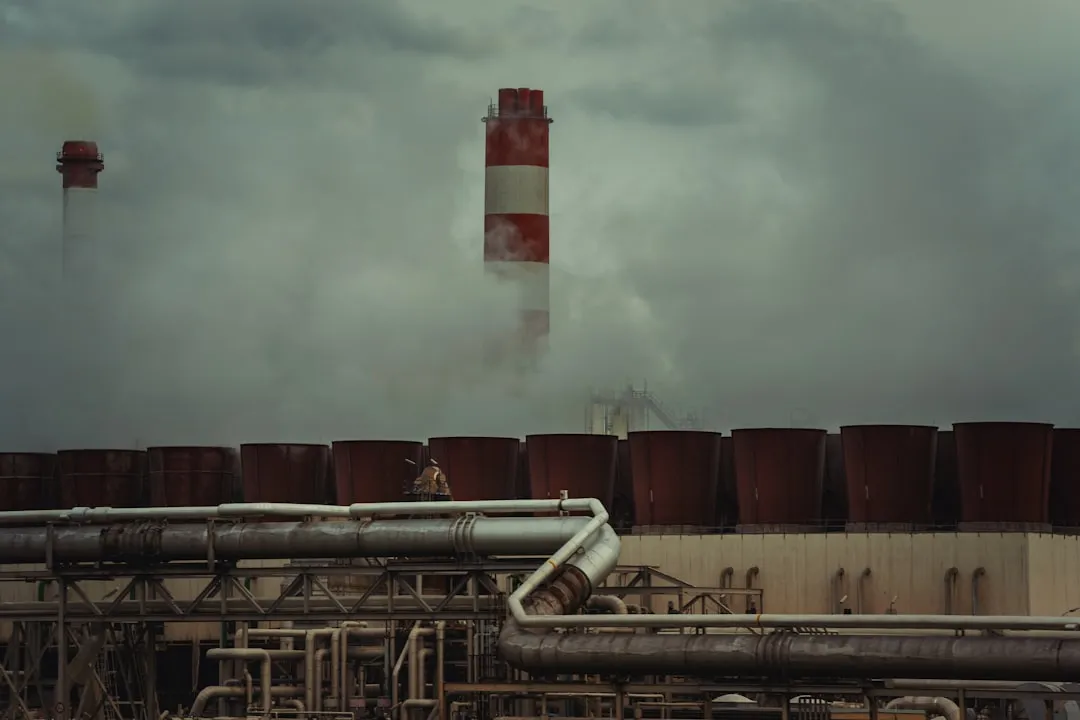 a large pipe with smoke coming out of it. Photo by Michael Pointner on Unsplash