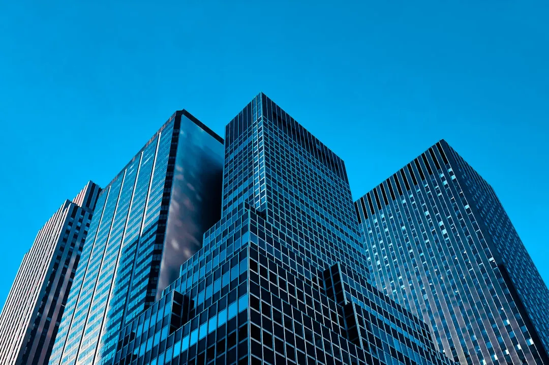 low angle view high rise buildings. Photo by Abbe Sublett on Unsplash