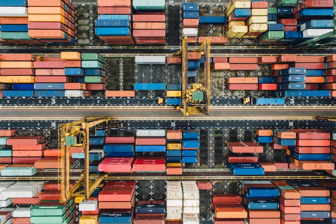 aerial photo of pile of enclose trailer. Photo by CHUTTERSNAP on Unsplash