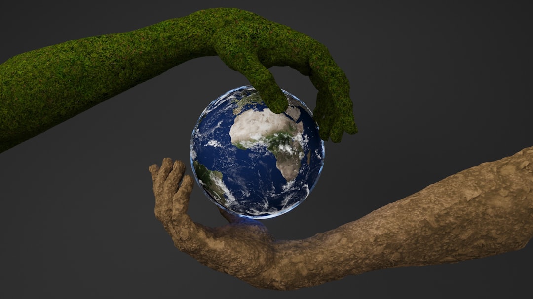 Two hands are holding a small earth globe — Photo by Bhautik Patel on Unsplash