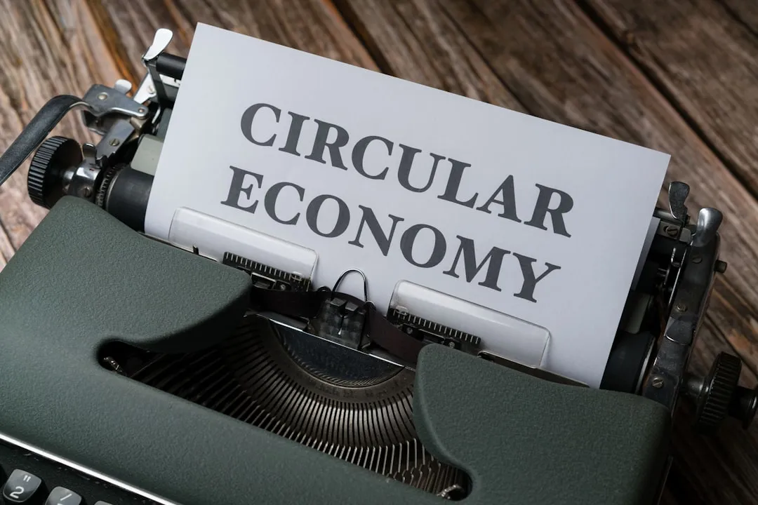 a close up of a typewriter with a paper that reads circular economy. Photo by Markus Winkler on Unsplash