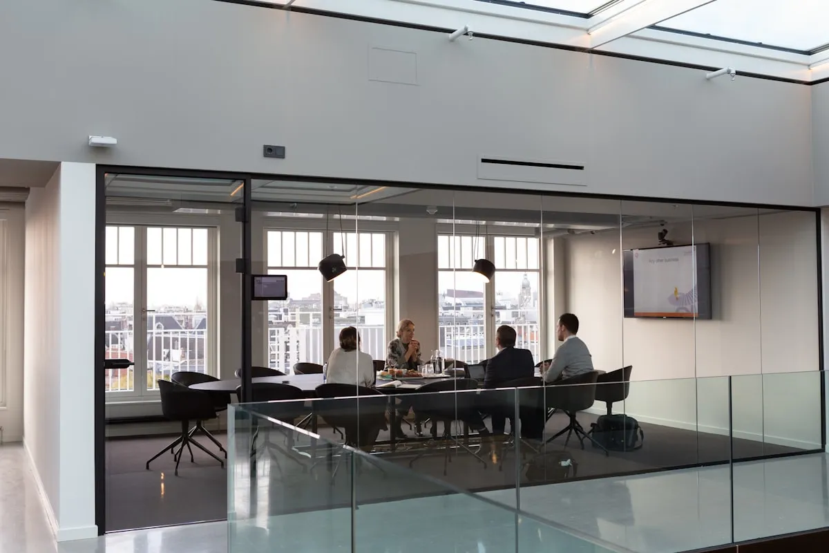 people sitting on chair inside building. Photo by Rodeo Project Management Software on Unsplash