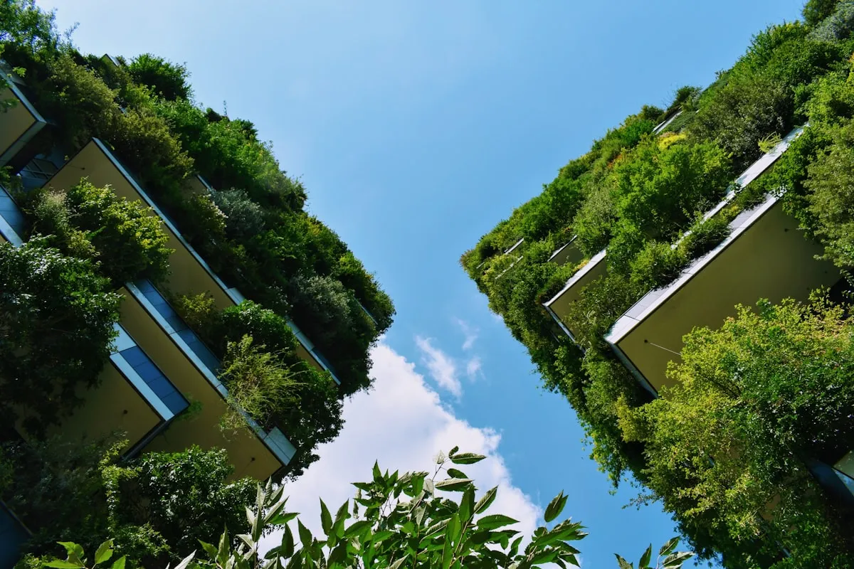 low-angle photography of buildings with plants on it. Photo by Gábor Molnár on Unsplash