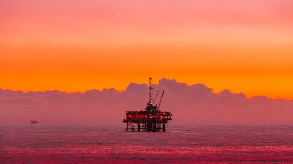 an oil rig in the middle of the ocean at sunset. Photo by Arvind Vallabh on Unsplash