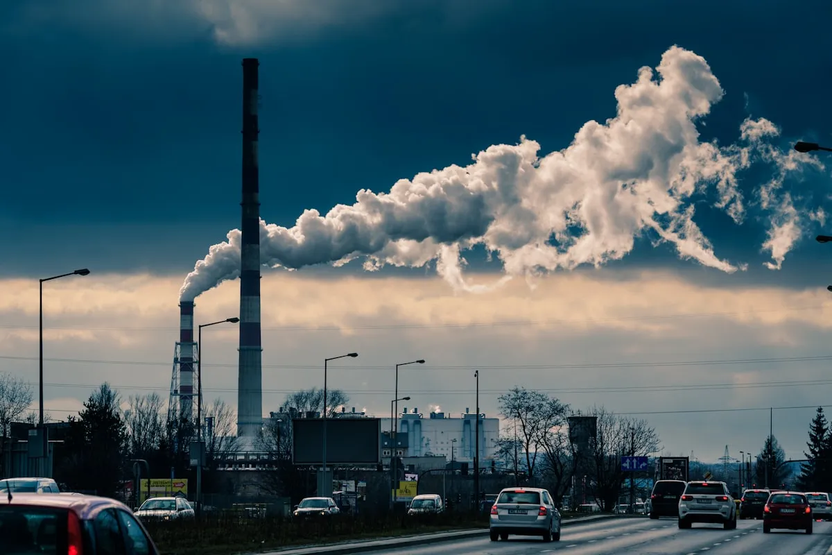 cars parked on parking lot under white clouds and blue sky during daytime. Photo by Jacek Dylag on Unsplash