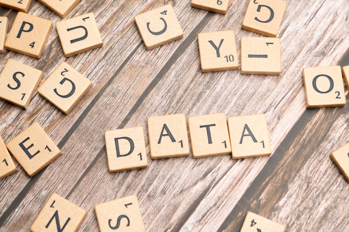 scrabble tiles spelling out the word data on a wooden surface — Photo by Markus Winkler on Unsplash