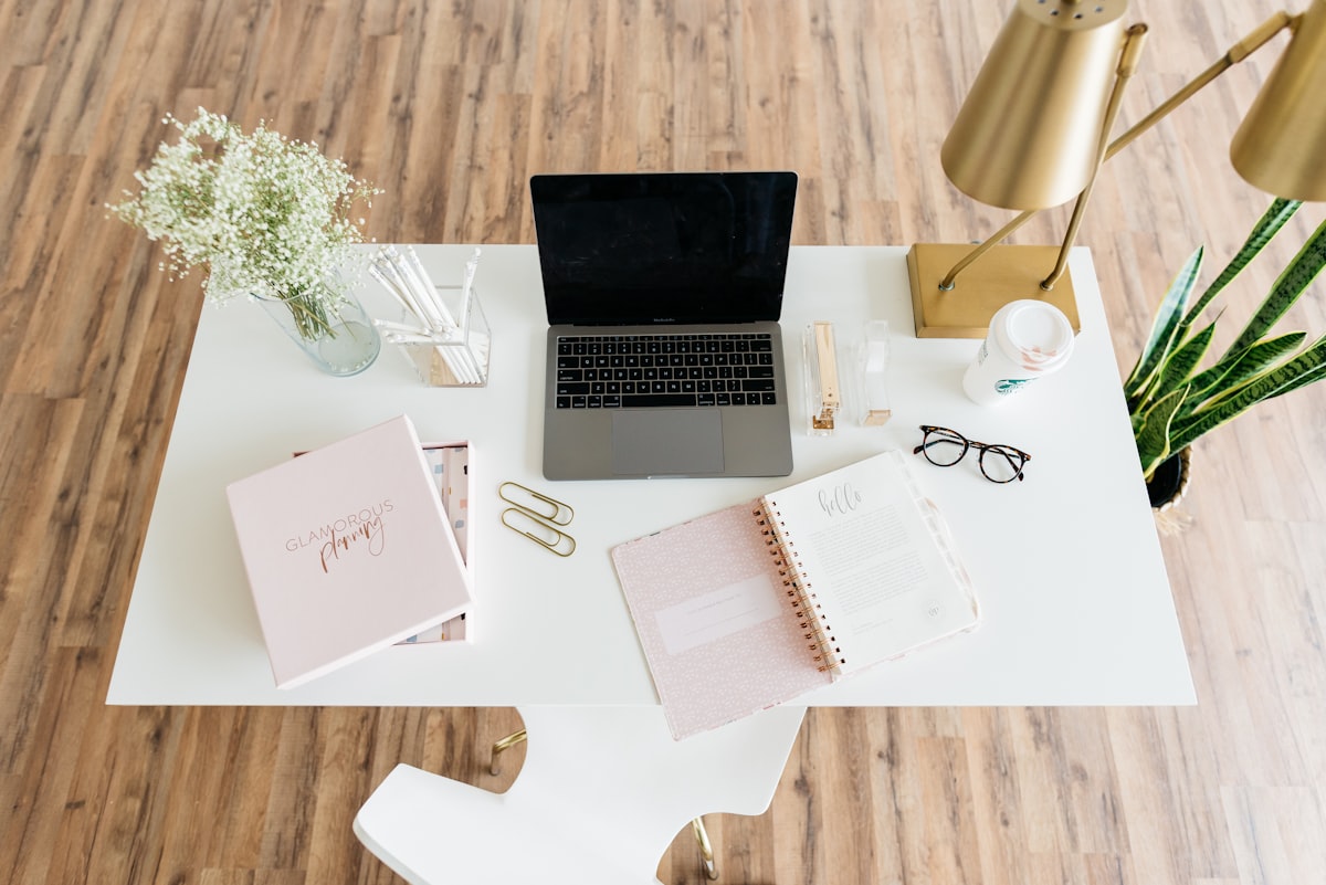 gray and black laptop computer on white table — Photo by Alexa Williams on Unsplash