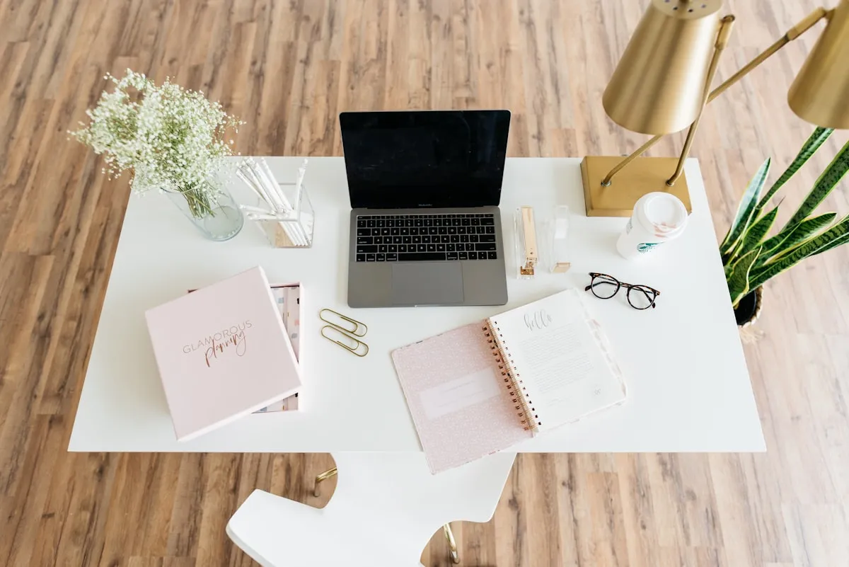 grey and black laptop computer on white table. Photo by Alexa Williams on Unsplash