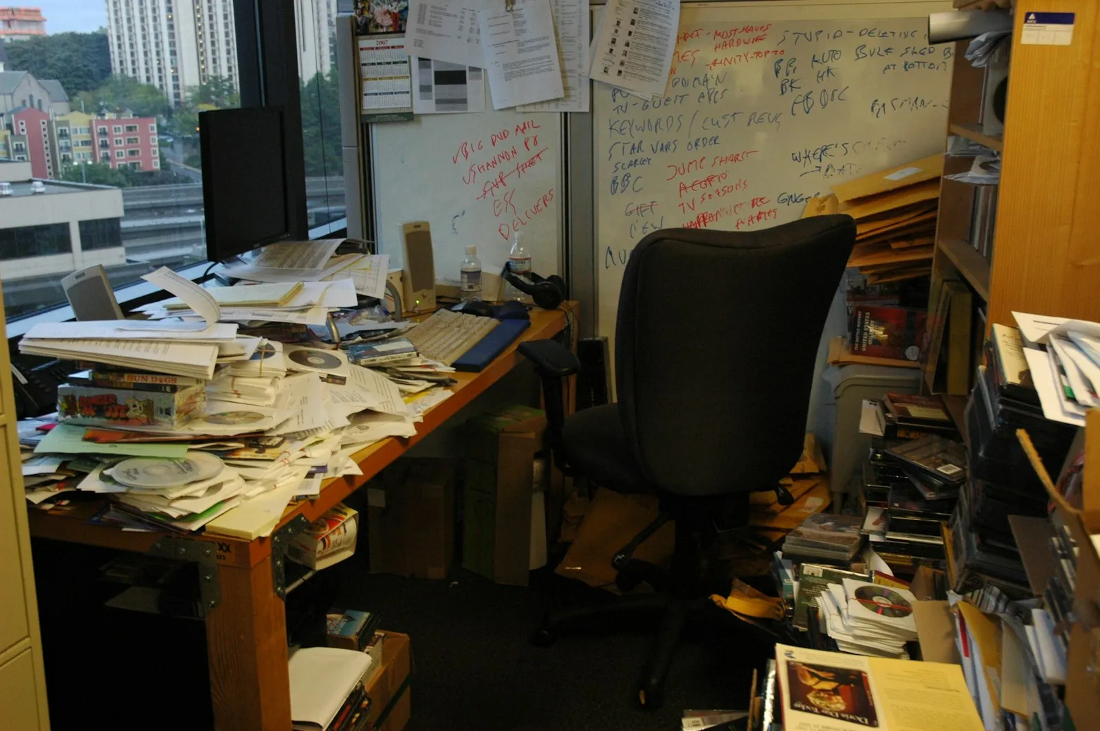 Office table with a pile of papers, Photo by Wonderlane on Unsplash
