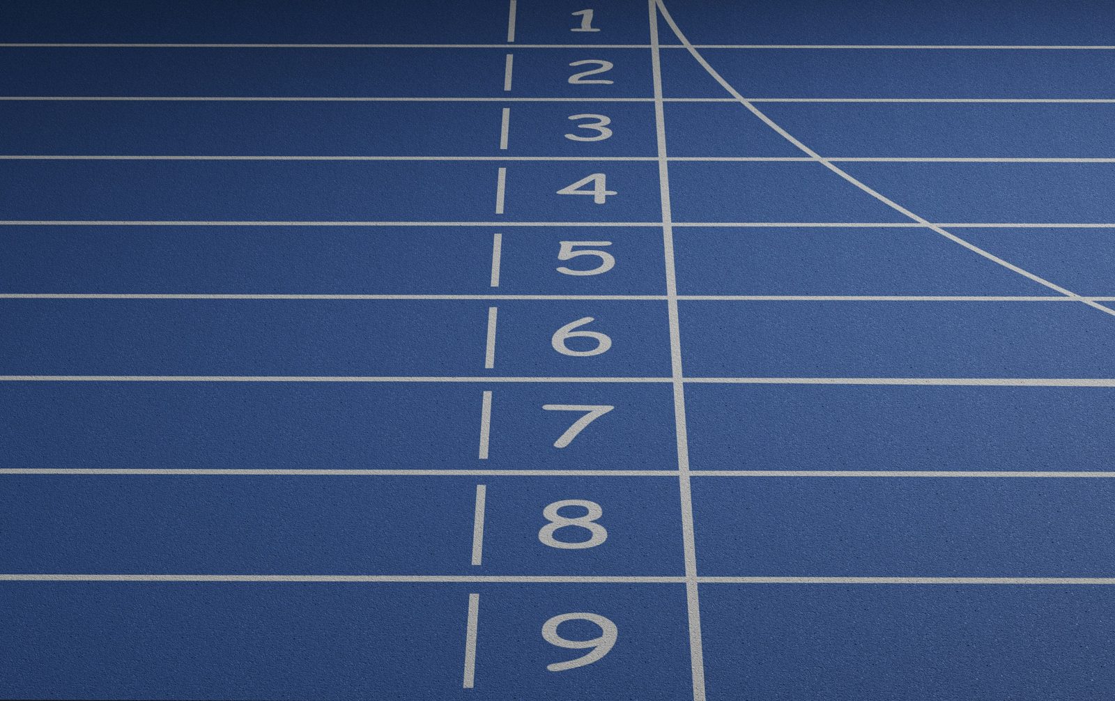 Numbered lanes 1 to 9 on a blue running track at the start line