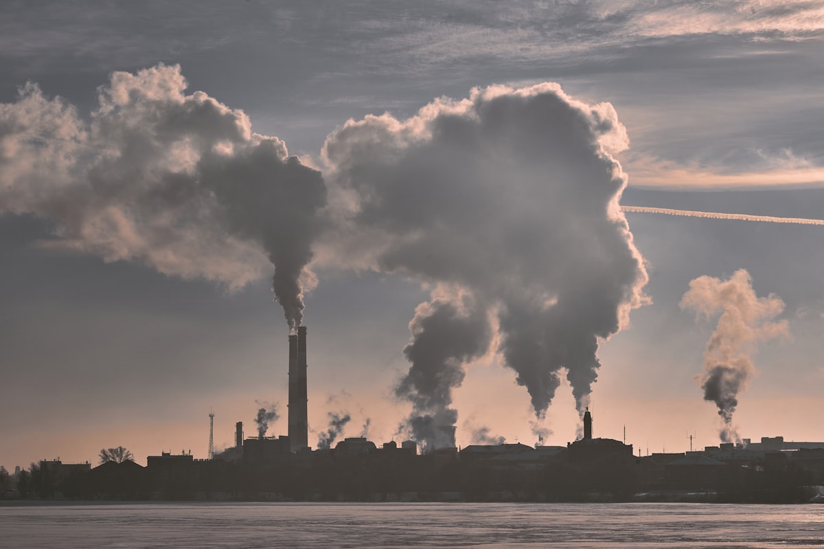 Office building against cloud, illustrating corporate value chain emissions