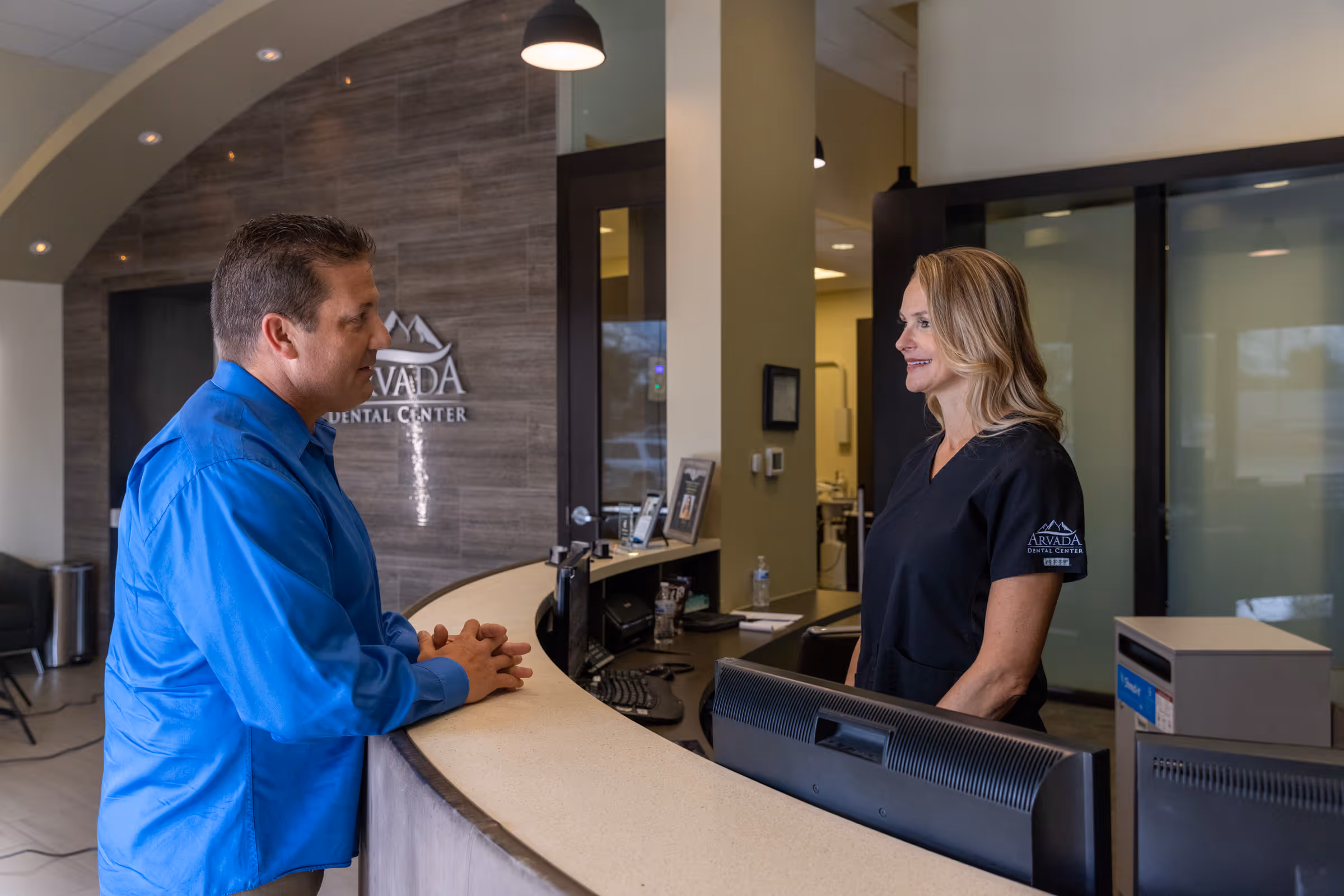 Arvada dentist welcoming a new patient at Arvada Dental Center & Implants