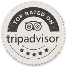 Round badge stating Top Rated on TripAdvisor with five stars and the TripAdvisor owl logo.